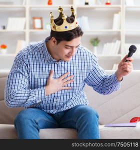 Funny man singing songs in karaoke at home. The funny man singing songs in karaoke at home