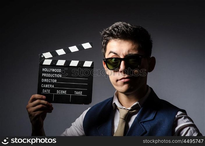 Funny man with movie clapboard