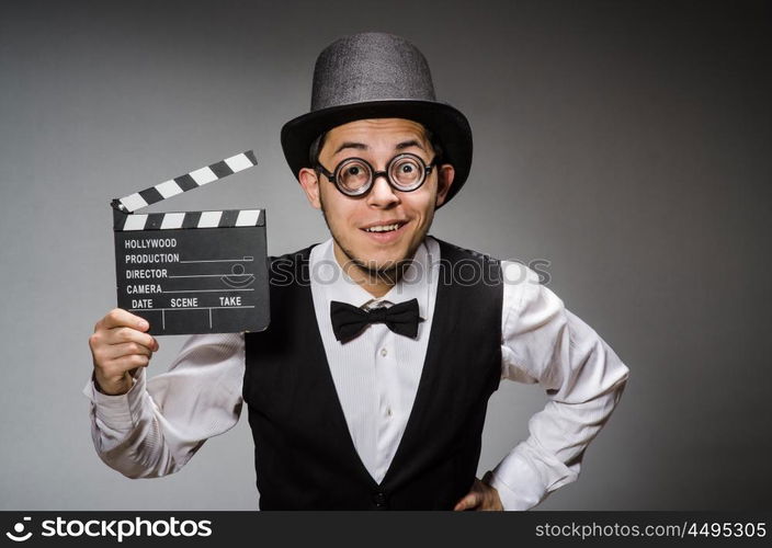 Funny man with movie clapper