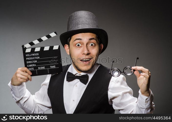 Funny man with movie clapper