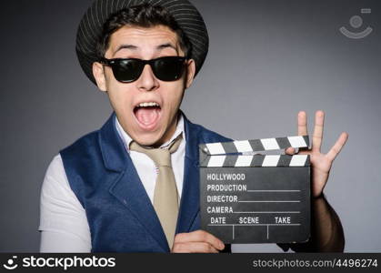 Funny man with movie clapper