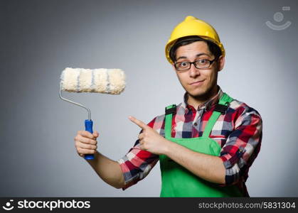 Funny painter with hardhat and roller