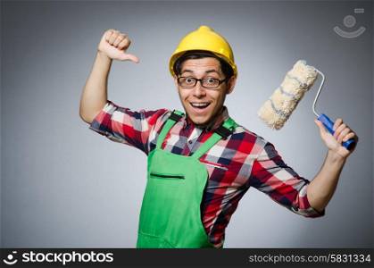 Funny painter with hardhat and roller