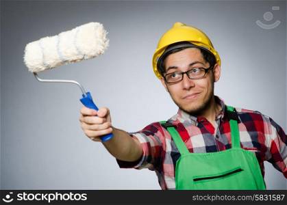 Funny painter with hardhat and roller