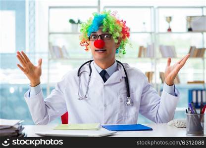 Funny pediatrician with clown wig in the hospital clinic. The funny pediatrician with clown wig in the hospital clinic