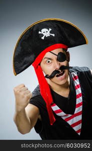 Funny pirate in the dark studio