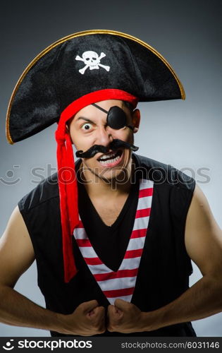 Funny pirate in the dark studio