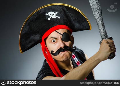 Funny pirate in the dark studio