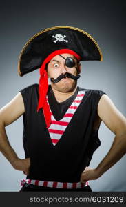 Funny pirate in the dark studio