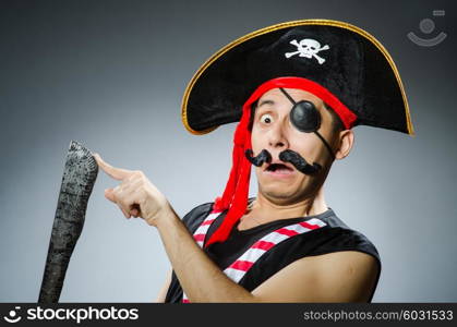 Funny pirate in the dark studio