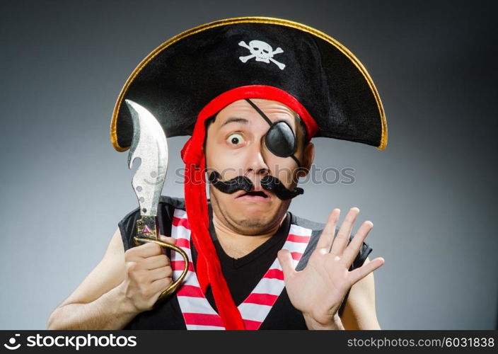 Funny pirate in the dark studio