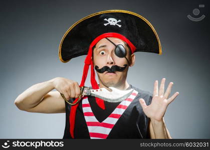 Funny pirate in the dark studio