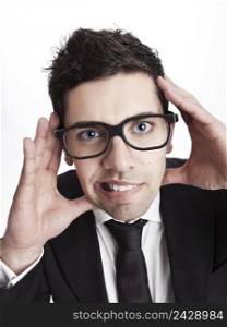Funny portrait of a young businessman with a nerd glasses