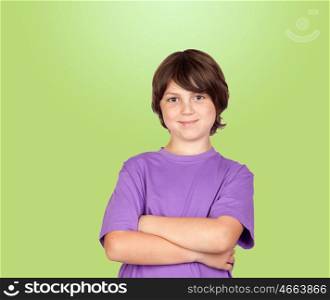 Funny portrait of freckled boy isolated on a green background