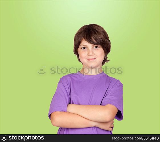 Funny portrait of freckled boy isolated on a green background