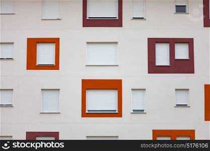 Funny residential building in Spain. All windows have shutters