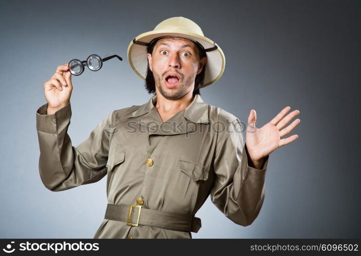 Funny safari hunter against background