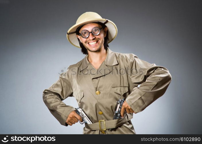 Funny safari hunter against background