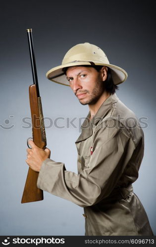 Funny safari hunter with rifle