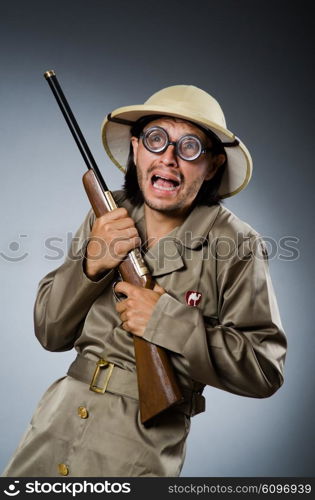 Funny safari hunter with rifle