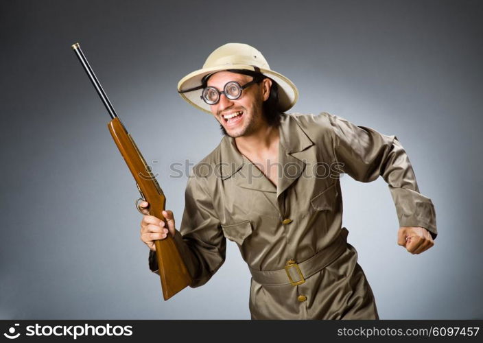 Funny safari hunter with rifle