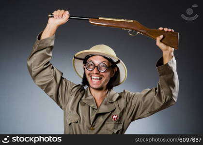 Funny safari hunter with rifle