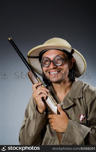 Funny safari hunter with rifle