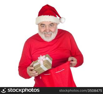 Funny Santa Claus taking a gift from his sack isolated on white background