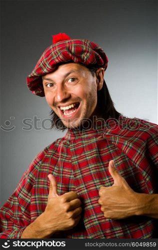 Funny scotsman in traditional clothing