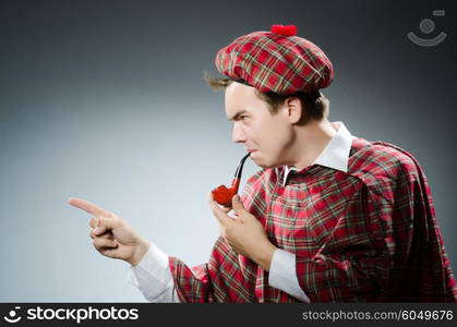 Funny scotsman smoking pipe tobacco