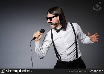 Funny singer with microphone at the concert