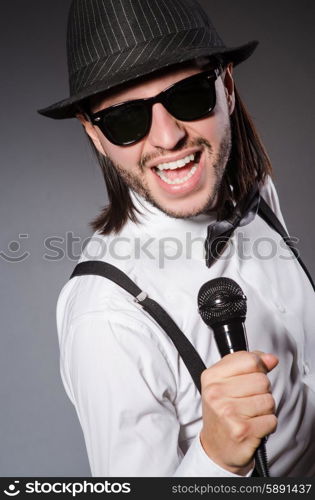 Funny singer with microphone at the concert