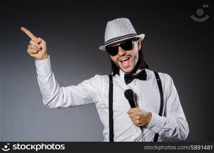 Funny singer with microphone at the concert