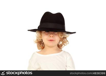 Funny small blond child with black hat isolated on a white background