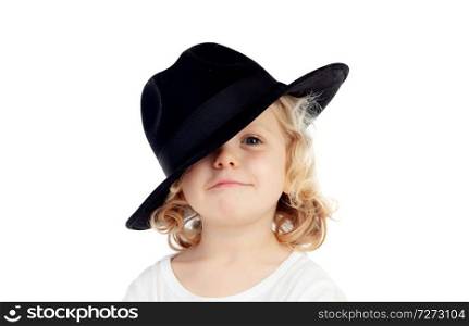 Funny small blond child with black hat isolated on a white background