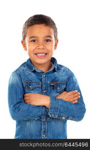 Funny small child with dark hair and black eyes crossing his arms isolated on a white background