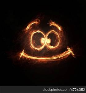 Funny smile icon. Glowing light smiley symbol on dark background