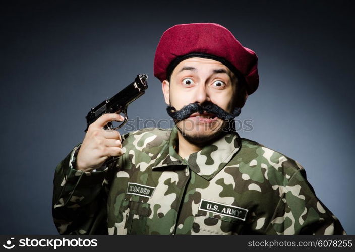 Funny soldier against the dark background