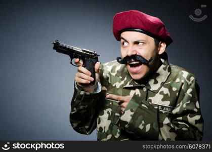 Funny soldier against the dark background