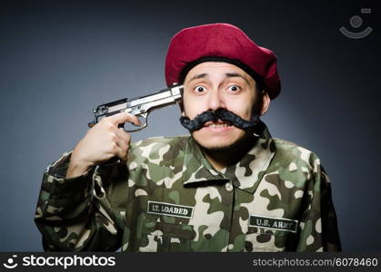 Funny soldier against the dark background