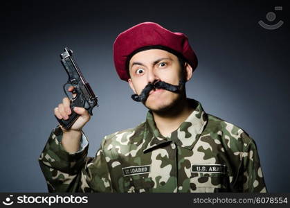 Funny soldier against the dark background