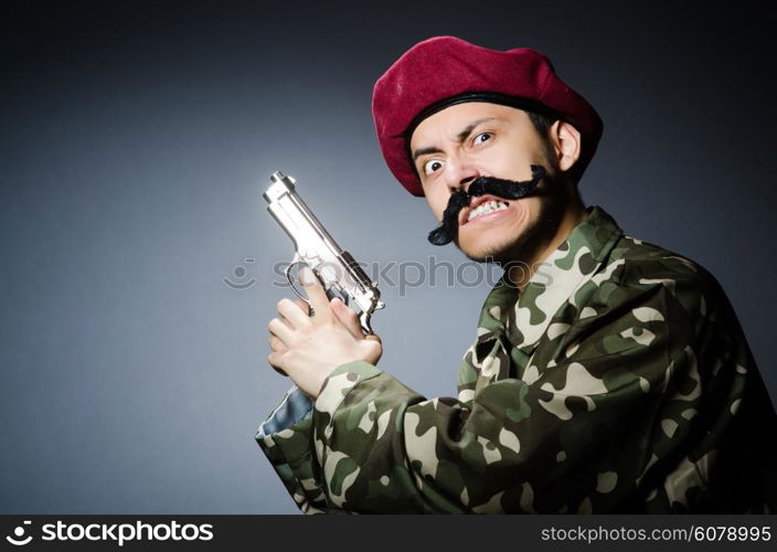 Funny soldier against the dark background