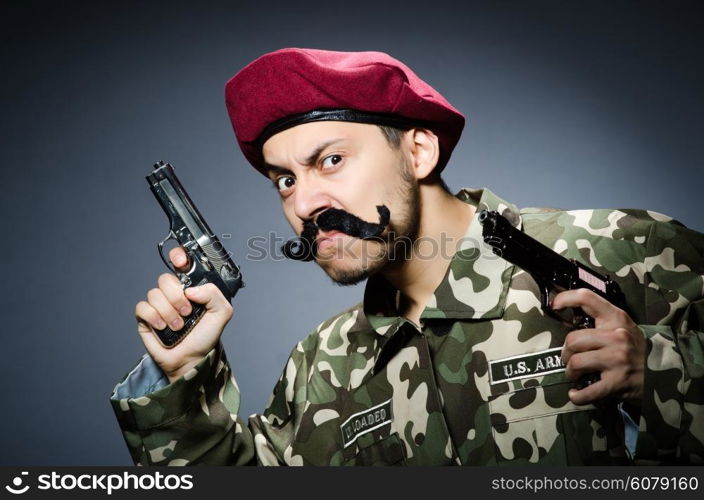 Funny soldier against the dark background