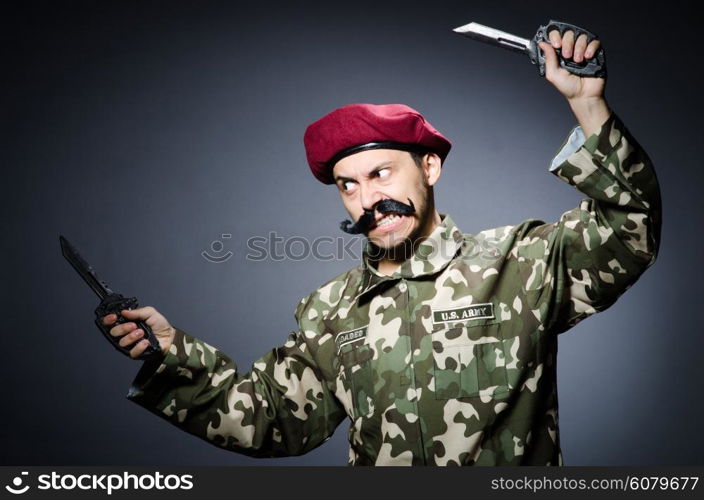 Funny soldier against the dark background