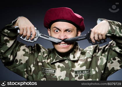 Funny soldier against the dark background