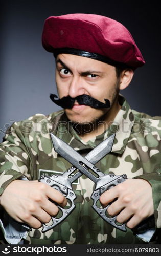 Funny soldier against the dark background