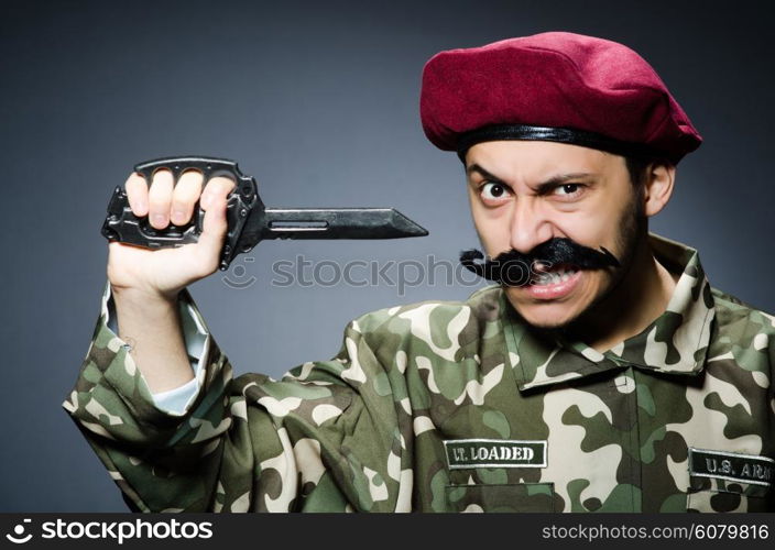 Funny soldier against the dark background