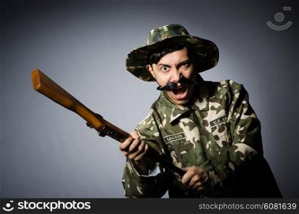 Funny soldier against the dark background
