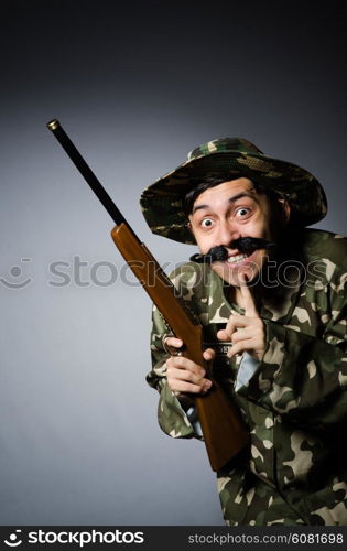 Funny soldier against the dark background