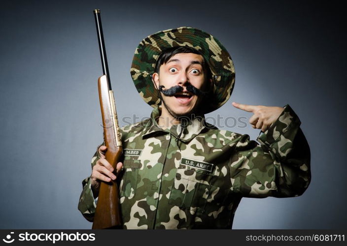 Funny soldier against the dark background